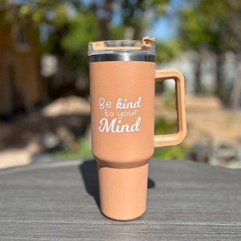 Indulge your senses and soothe your mind with our 40oz Mocha Tumbler - a perfect blend of mental wellness and coffee love. Our Be Kind to Your Mind Mocha 40oz Tumbler is not just any ordinary drinkware. It's a reminder that mental wellness and self-care should always be at the top of our minds, especially for coffee enthusiasts who may sometimes forget to take care of themselves amidst their busy schedules.