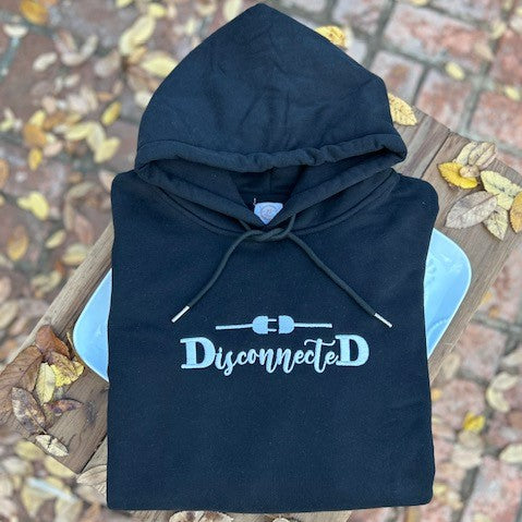 Our "DisconnecteD" black fleece-lined hoodie is professionally embroidered with white cursive letters with two black capital D's on each end. Above the word "DisconnecteD," sits a white unconnected power cord. I focus on the word, "DisconnecteD," quite a bit in my product line because it really describes how I felt when I had PPD - disconnected from the world, from my baby, and from myself.