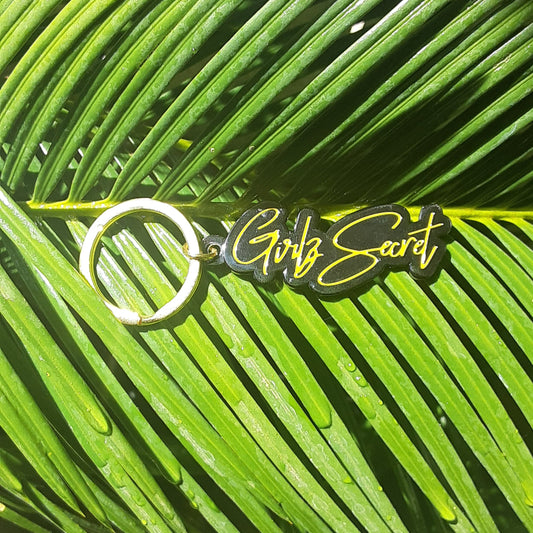 Super chic in black and gold, our Girlz Secret keychain is a stylish way to hold your car or house keys, or maybe even the key to your diary. I don't know about you, but I have a lot of keys and I often forget what they're for. A keyring like this one reminds me that I'm not alone, and there are others experiencing PPD. DETAILS 1.25 high x 2 inches wide keychain. 1.5-inch gold split ring. Features our Girlz Secret logo in black hard enamel with matte gold plating.