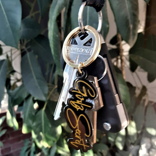 Super chic in black and gold, our Girlz Secret keychain is a stylish way to hold your car or house keys, or maybe even the key to your diary. I don't know about you, but I have a lot of keys and I often forget what they're for. A keyring like this one reminds me that I'm not alone, and there are others experiencing PPD. DETAILS 1.25 high x 2 inches wide keychain. 1.5-inch gold split ring. Features our Girlz Secret logo in black hard enamel with matte gold plating.