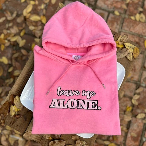 Our "Leave Me Alone" rose pink fleece-lined hoodie is professionally embroidered with pink letters lined in black. It's very normal to want to be left alone when you have PPD. During my time with PPD, I was in my own little world and I just wanted to be left alone with my baby. While I think the solitude helped me with the emotions I was feeling at the time, it also made me feel lonely and depressed.