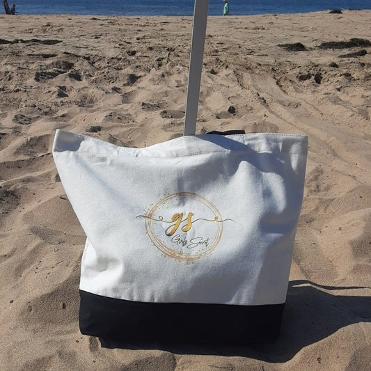 Our roomy Girlz Secret canvas tote bag is perfect as a book bag, market bag or to take to the beach. I've always felt that you could never have too many tote bags lying around, and this one is such a great size, and an excellent way to show your support for others suffering from Postpartum Depression. DETAILS 100% Cotton canvas. Beige with black straps and black bottom. Flat bottom so it can stand on its own. Our Girlz Secret logo appears on both sides of the bag.