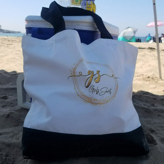 Our roomy Girlz Secret canvas tote bag is perfect as a book bag, market bag or to take to the beach. I've always felt that you could never have too many tote bags lying around, and this one is such a great size, and an excellent way to show your support for others suffering from Postpartum Depression. DETAILS 100% Cotton canvas. Beige with black straps and black bottom. Flat bottom so it can stand on its own. Our Girlz Secret logo appears on both sides of the bag.