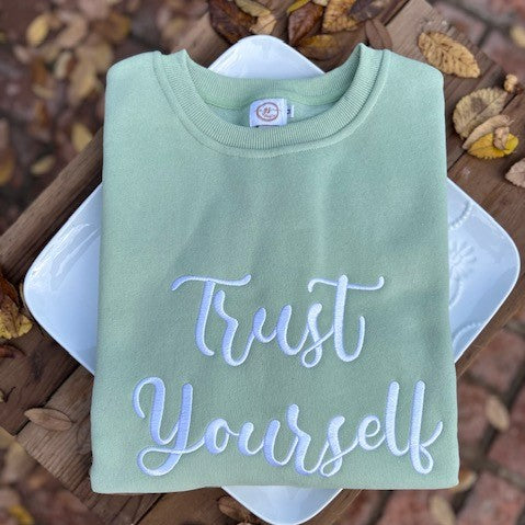 Our "Trust Yourself" sweatshirt for women is professionally embroidered featuring a lovely olive green fleece-lined crewneck sweatshirt with white cursive lettering. When you are suffering from PPD, you have to trust yourself. It can be such a confusing time, and I remember having to constantly remind myself that I am doing the right things for me and my baby.